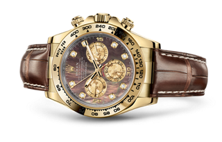 Rolex - 116518-0073  Cosmograph Daytona Yellow Gold / Black Mother of Pearl / Strap