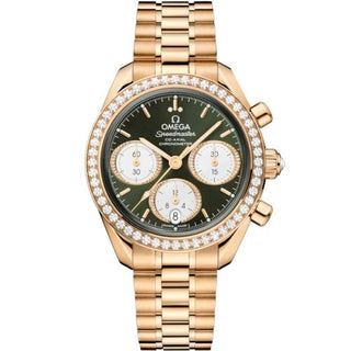 Omega - 324.55.38.50.60.001  Speedmaster Date 38 Moonshine Gold - Diamond / Green / Bracelet